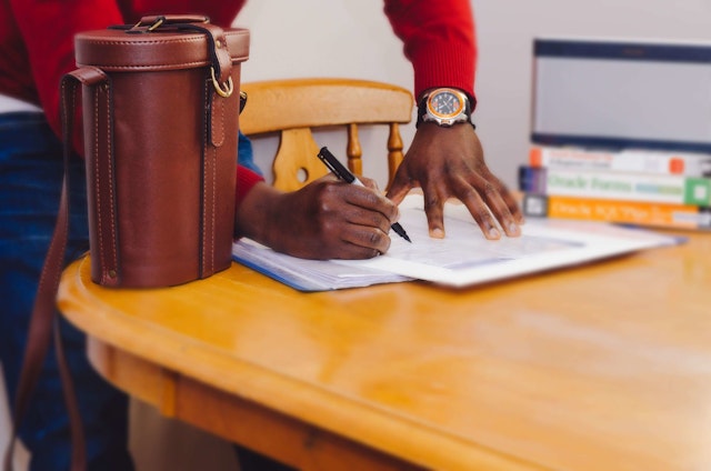 A man writing on paper