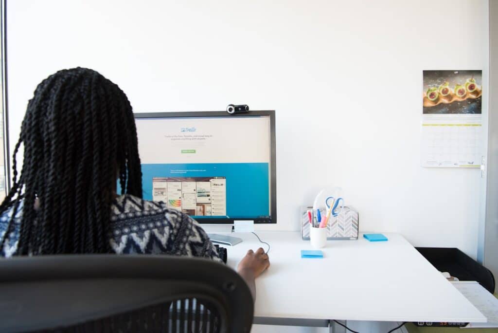 woman working on a desktop laptop