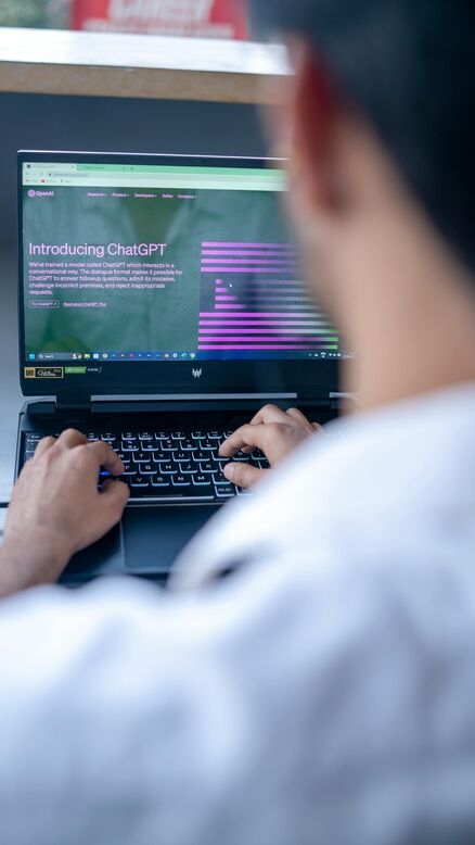 A man typing on a laptop