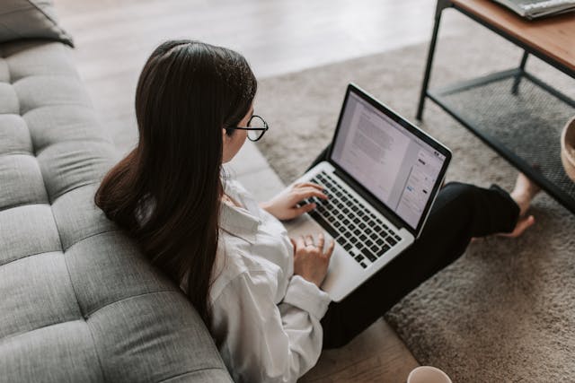 A woman working at home on her laptop