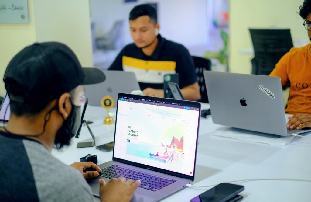 People working on laptops in an office space