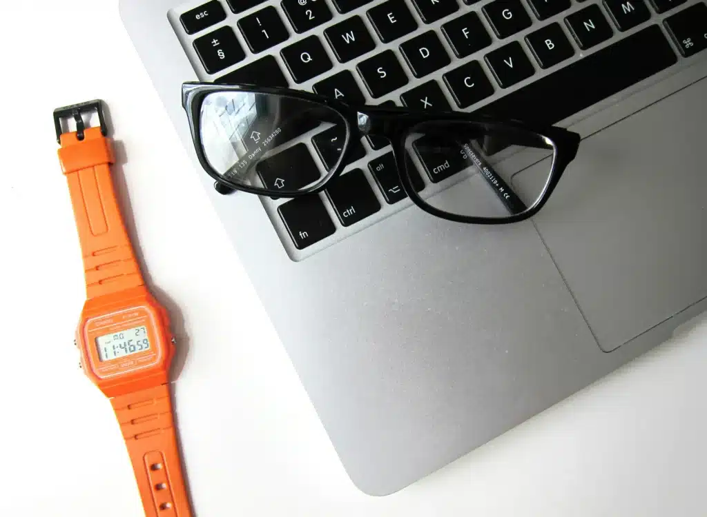 watch, laptop and glasses