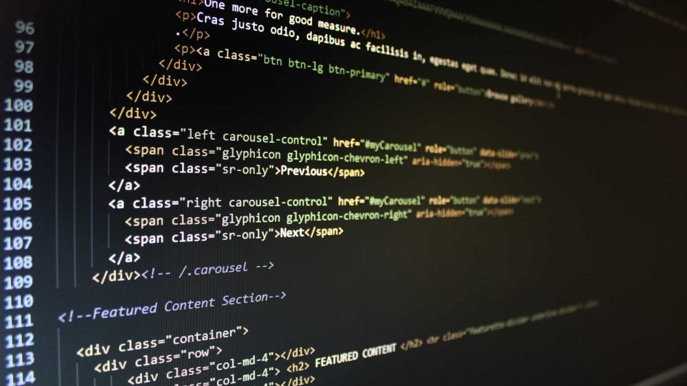 A laptop screen with some code syntax